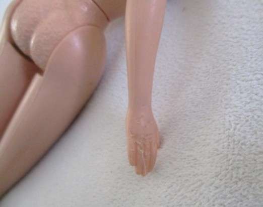 Vintage 1990's Barbie with pull-string length altering hair - knees bend