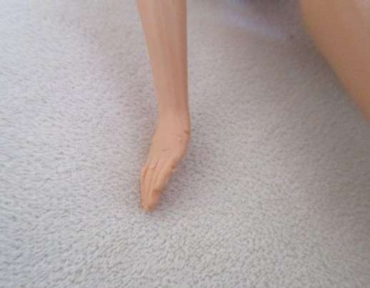 Vintage 1990's Barbie with pull-string length altering hair - knees bend