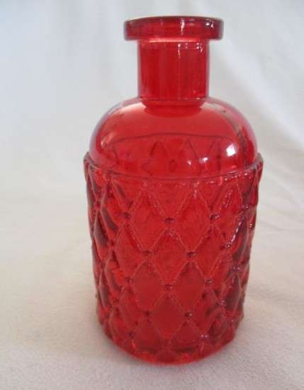 Three pretty red glass bottles (please disregard reflections)