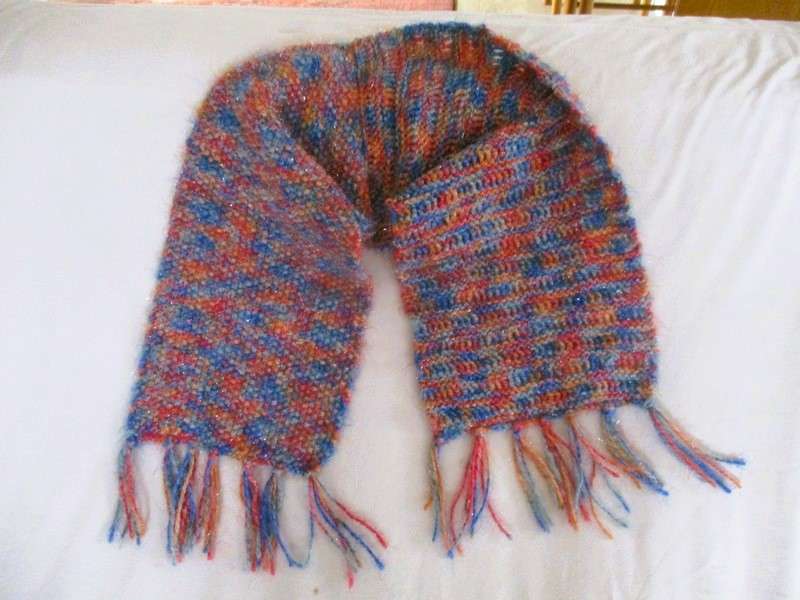 Beautiful, thick hand knitted scarf with shiny thread running through it