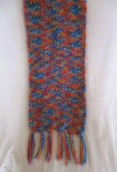 Beautiful, thick hand knitted scarf with shiny thread running through it