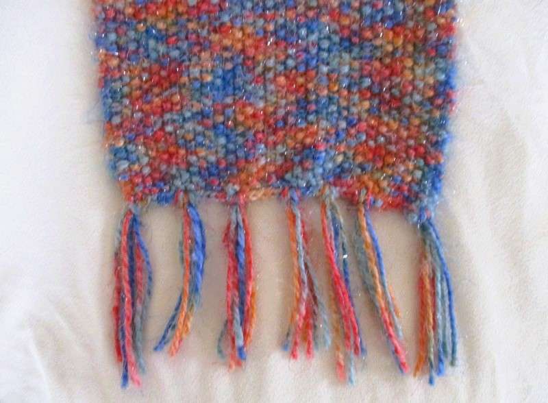Beautiful, thick hand knitted scarf with shiny thread running through it