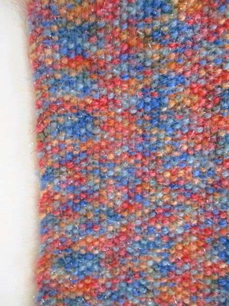 Beautiful, thick hand knitted scarf with shiny thread running through it