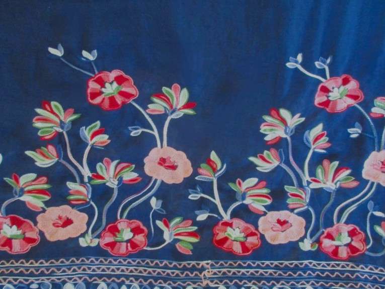 A beautiful embroidered shawl/throw with lovely floral design