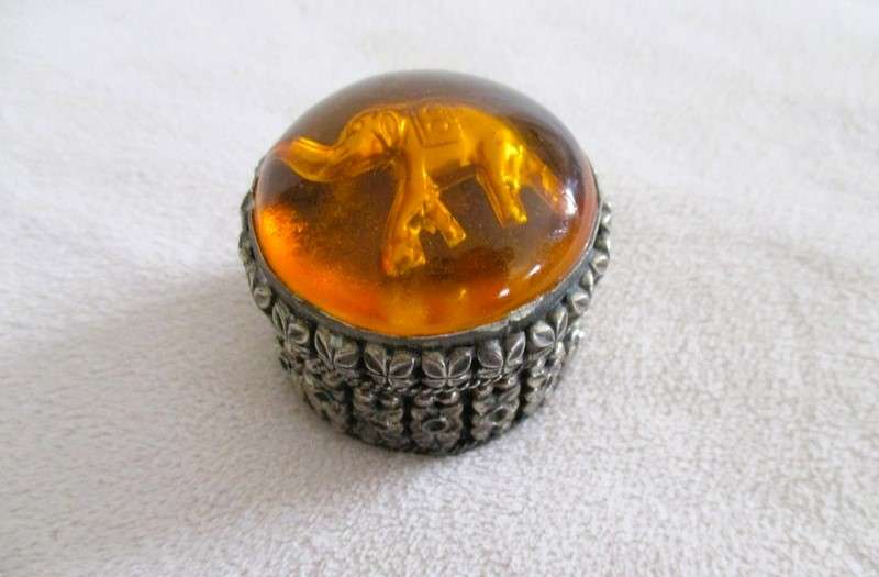 Ornate metal pill box with elephant detail