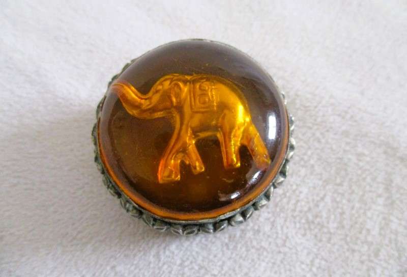 Ornate metal pill box with elephant detail