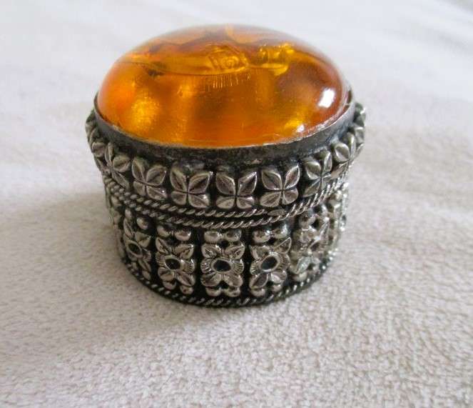 Ornate metal pill box with elephant detail