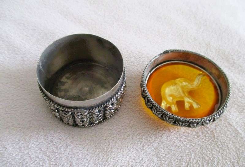 Ornate metal pill box with elephant detail