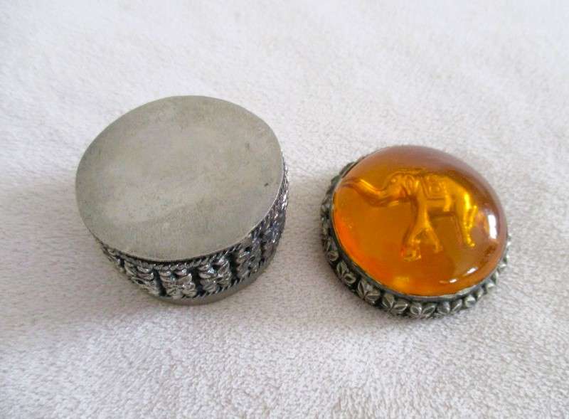 Ornate metal pill box with elephant detail