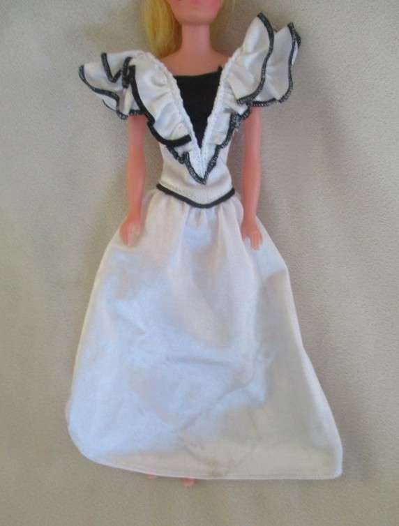 A vintage Barbie clone doll with ""cat eye" make up and beauty spot - made in Hong Kong