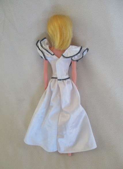 A vintage Barbie clone doll with ""cat eye" make up and beauty spot - made in Hong Kong