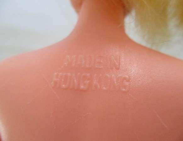 A vintage Barbie clone doll with ""cat eye" make up and beauty spot - made in Hong Kong