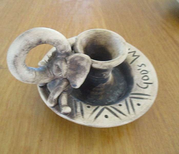 Two quaint handcrafted pottery candlesticks from God's Window - gecko and elephant