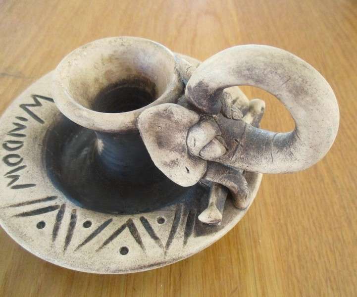 Two quaint handcrafted pottery candlesticks from God's Window - gecko and elephant