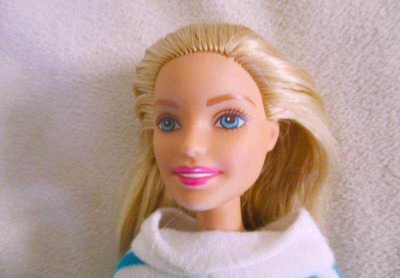 A pretty Mattel Barbie doll  in cute striped tracksuit