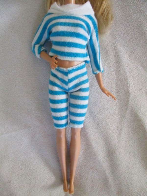 A pretty Mattel Barbie doll  in cute striped tracksuit