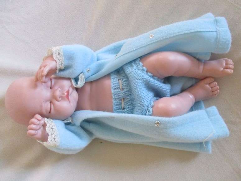 Reborn doll? Have you ever seen such a cute face?  Vinyl not porcelain