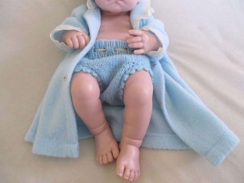 Reborn doll? Have you ever seen such a cute face?  Vinyl not porcelain