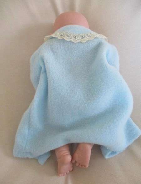 Reborn doll? Have you ever seen such a cute face?  Vinyl not porcelain