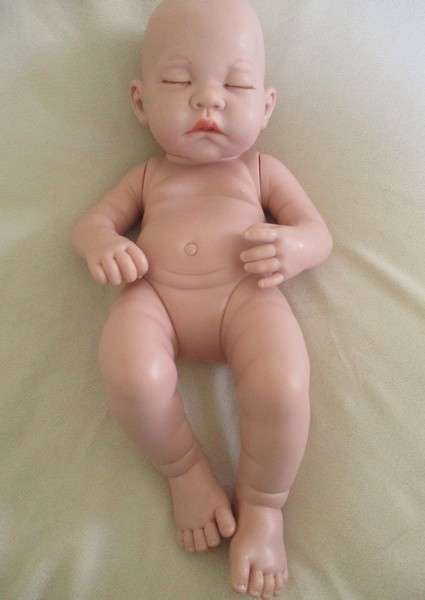 Reborn doll? Have you ever seen such a cute face?  Vinyl not porcelain