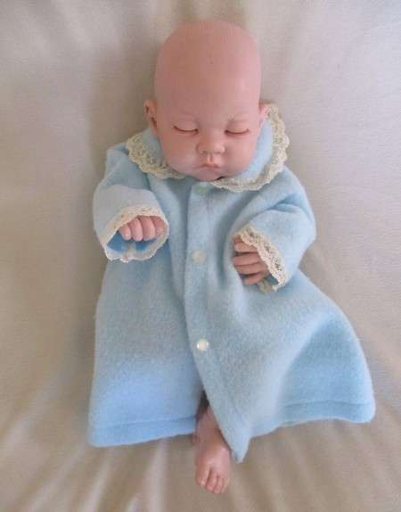 Reborn doll? Have you ever seen such a cute face?  Vinyl not porcelain
