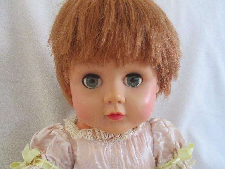 A well made vintage doll with separated toes - marked "J" on back of head