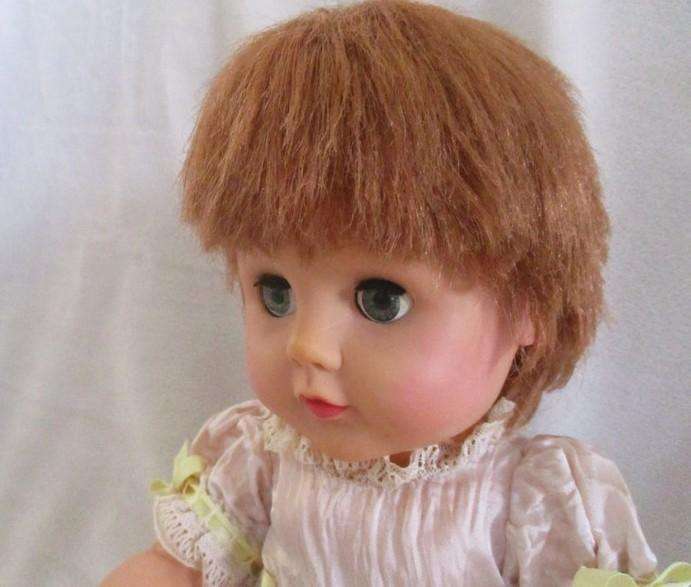 A well made vintage doll with separated toes - marked "J" on back of head