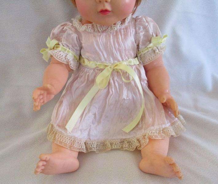A well made vintage doll with separated toes - marked "J" on back of head