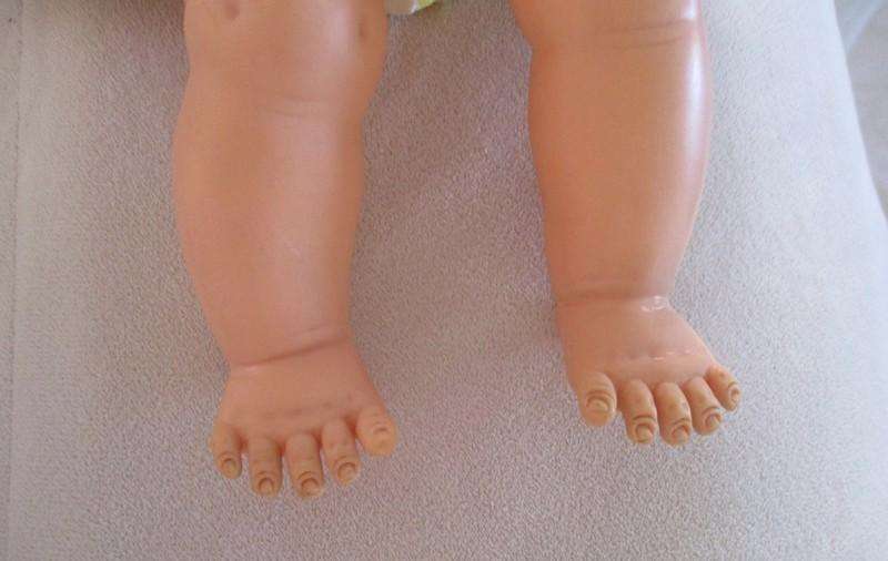 A well made vintage doll with separated toes - marked "J" on back of head