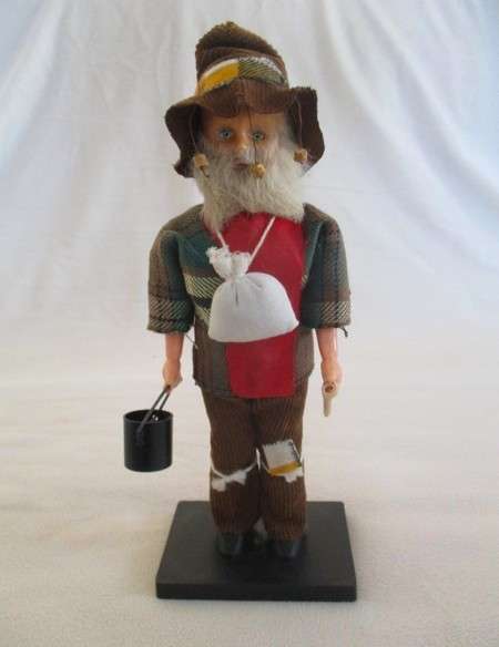 Cute vintage Australian Swagman doll on stand