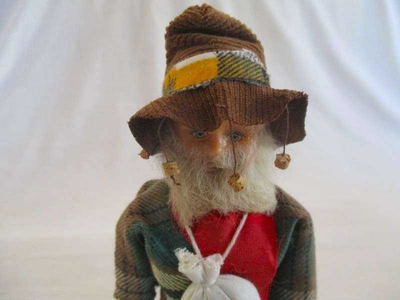 Cute vintage Australian Swagman doll on stand