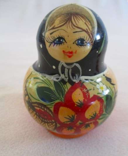 Four piece set of vintage genuine Russian wooden hand painted Matryoshka nesting dolls