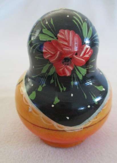 Four piece set of vintage genuine Russian wooden hand painted Matryoshka nesting dolls