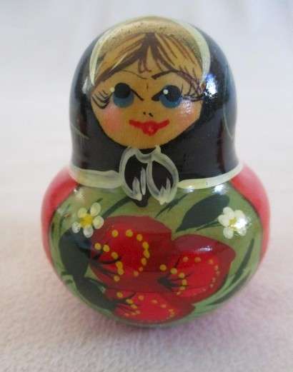 Four piece set of vintage genuine Russian wooden hand painted Matryoshka nesting dolls
