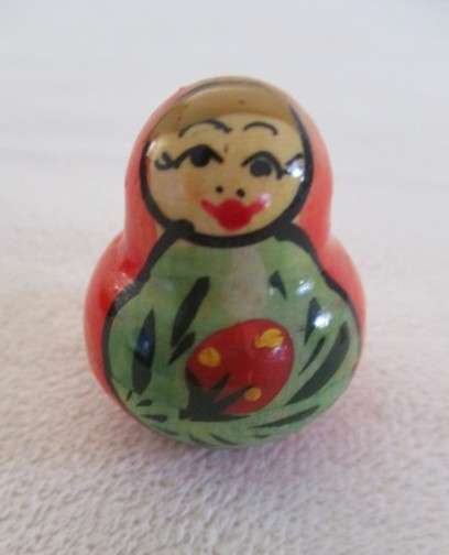 Four piece set of vintage genuine Russian wooden hand painted Matryoshka nesting dolls