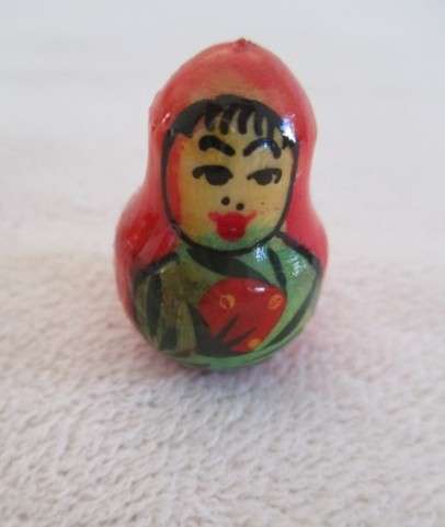 Four piece set of vintage genuine Russian wooden hand painted Matryoshka nesting dolls