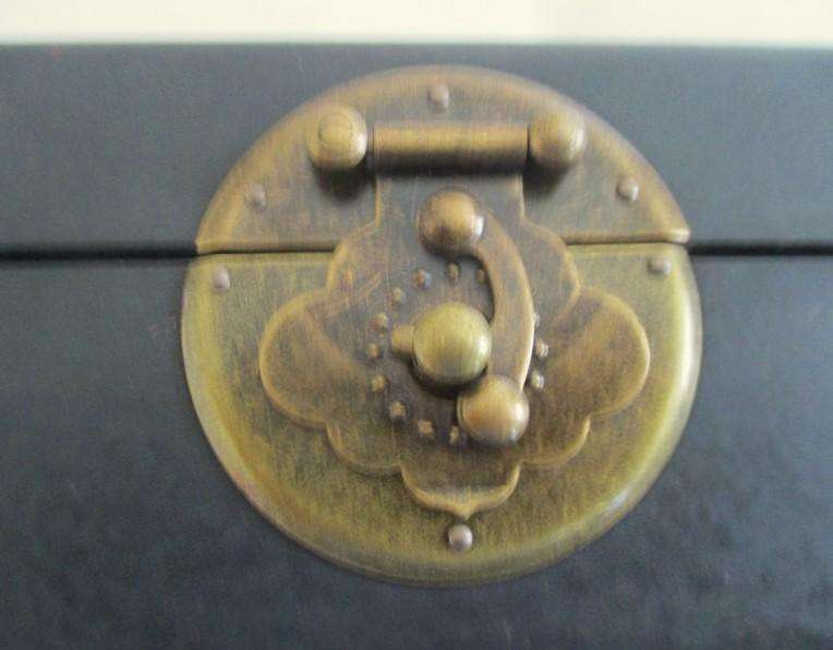 A vintage hand painted oriental "treasure box" with beautiful floral and bird  painted on leather