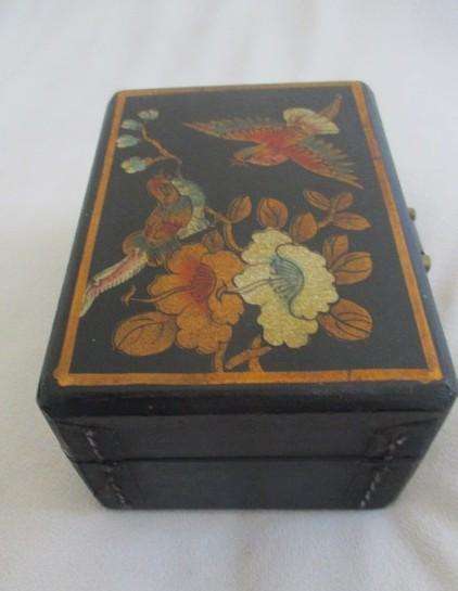 A vintage hand painted oriental "treasure box" with beautiful floral and bird  painted on leather