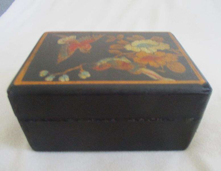 A vintage hand painted oriental "treasure box" with beautiful floral and bird  painted on leather