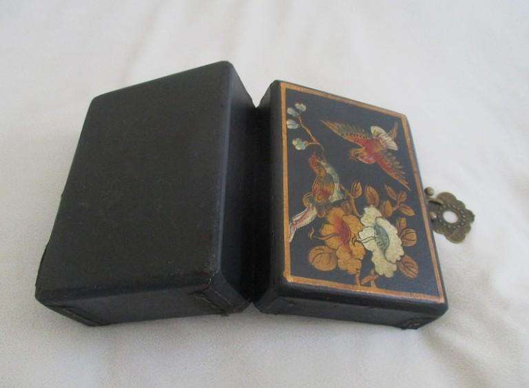 A vintage hand painted oriental "treasure box" with beautiful floral and bird  painted on leather