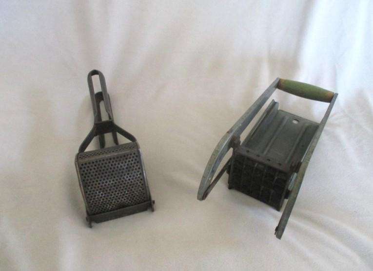 Two vintage potato kitchen utensils - masher and french fry cutter