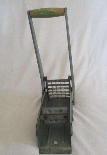 Two vintage potato kitchen utensils - masher and french fry cutter