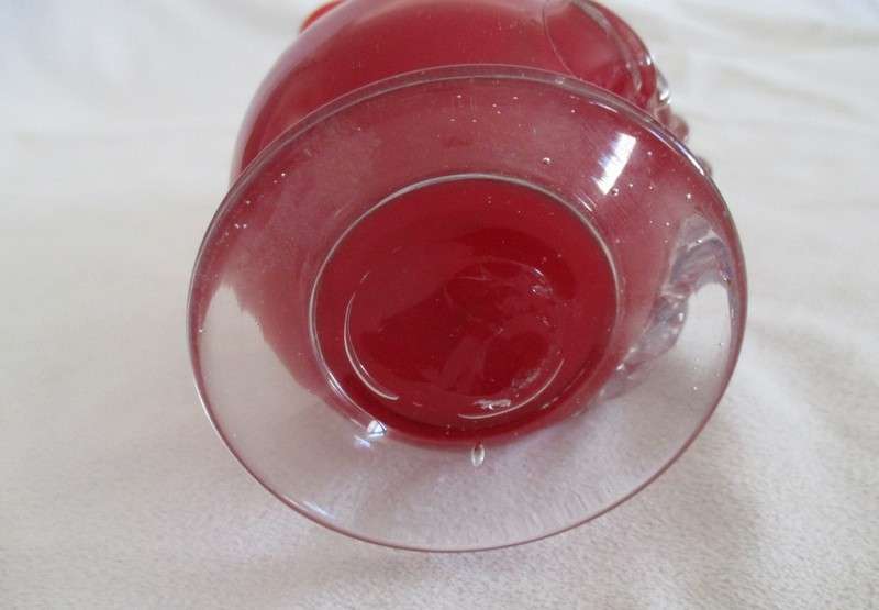 Vintage 18cm tall red hand blown art glass vase with fluted rim and applied floral design