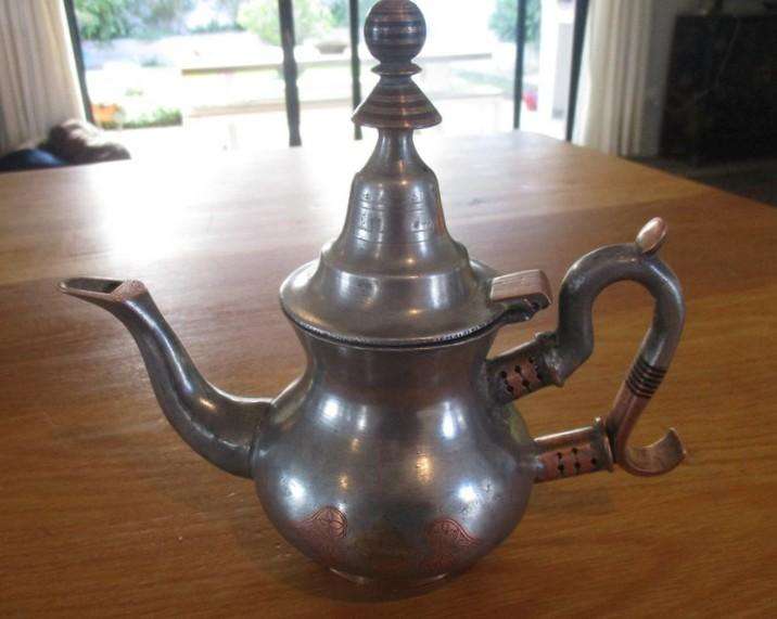 An old antique Moorish teapot handcrafted by the nomadic Tuareg people of the N.W. African Sahara