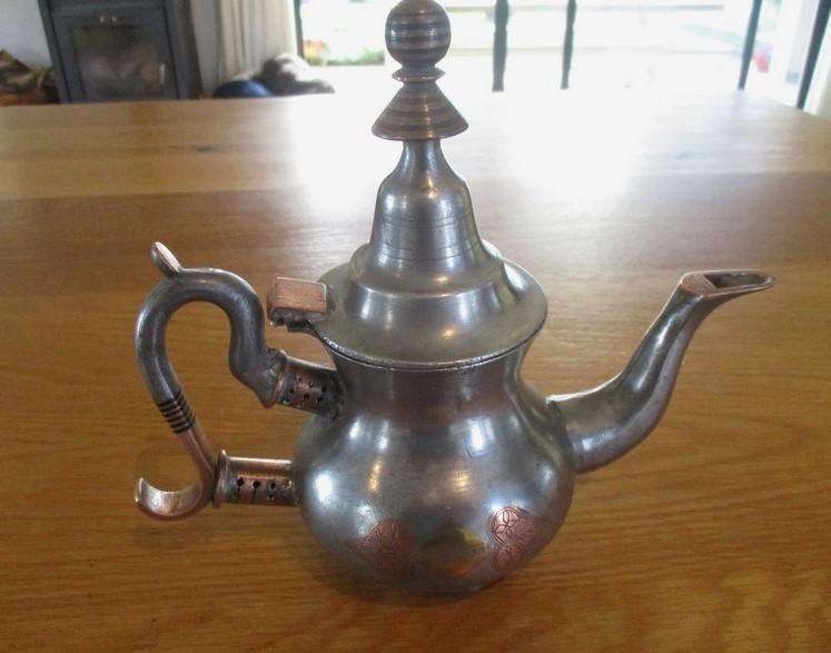 An old antique Moorish teapot handcrafted by the nomadic Tuareg people of the N.W. African Sahara