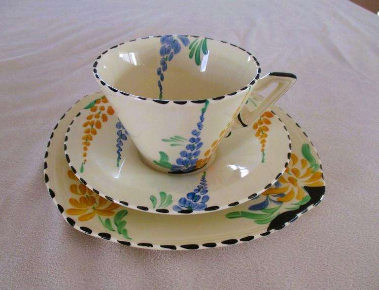 Four rare 1930's Art Deco Burleigh Ware Zenith trios with blue and yellow lupins