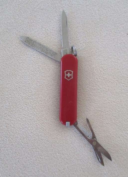Small vintage Victorinox Swiss Army Knife plus other small fold-up tool gadget