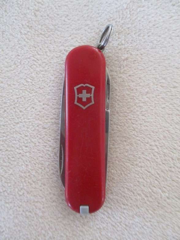 Small vintage Victorinox Swiss Army Knife plus other small fold-up tool gadget