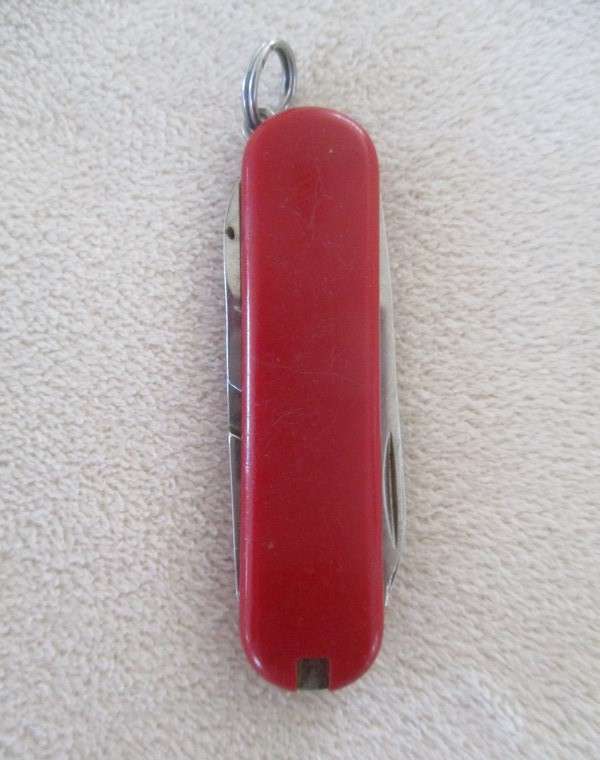 Small vintage Victorinox Swiss Army Knife plus other small fold-up tool gadget