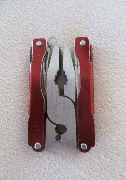 Small vintage Victorinox Swiss Army Knife plus other small fold-up tool gadget